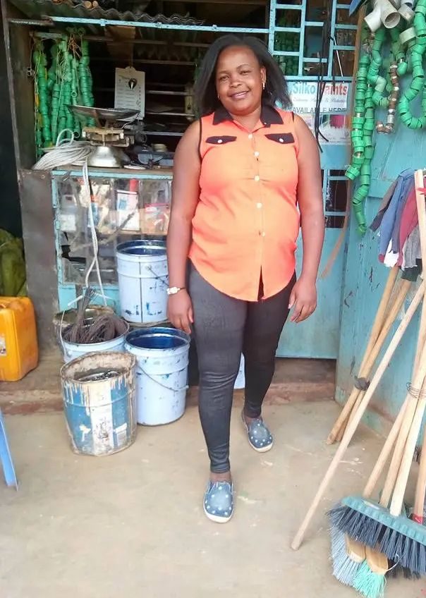 Director Gladys Wakuthi Muchira outside the hardware shop